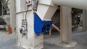 Animal feed transfer chute with integral magnet