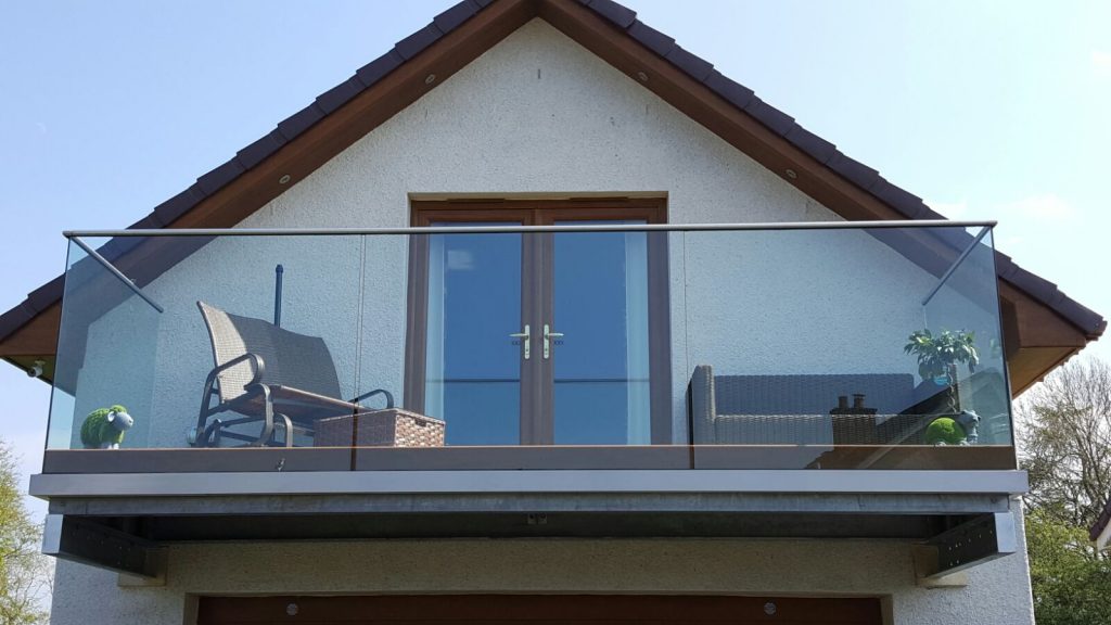 Balcony complete with toughened glass balustrade