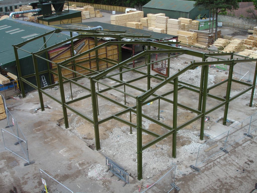 New portal frame including floor steel for reconstruction works of a roundwood timber mill