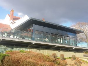 Patio decking and glass dining room conservatory